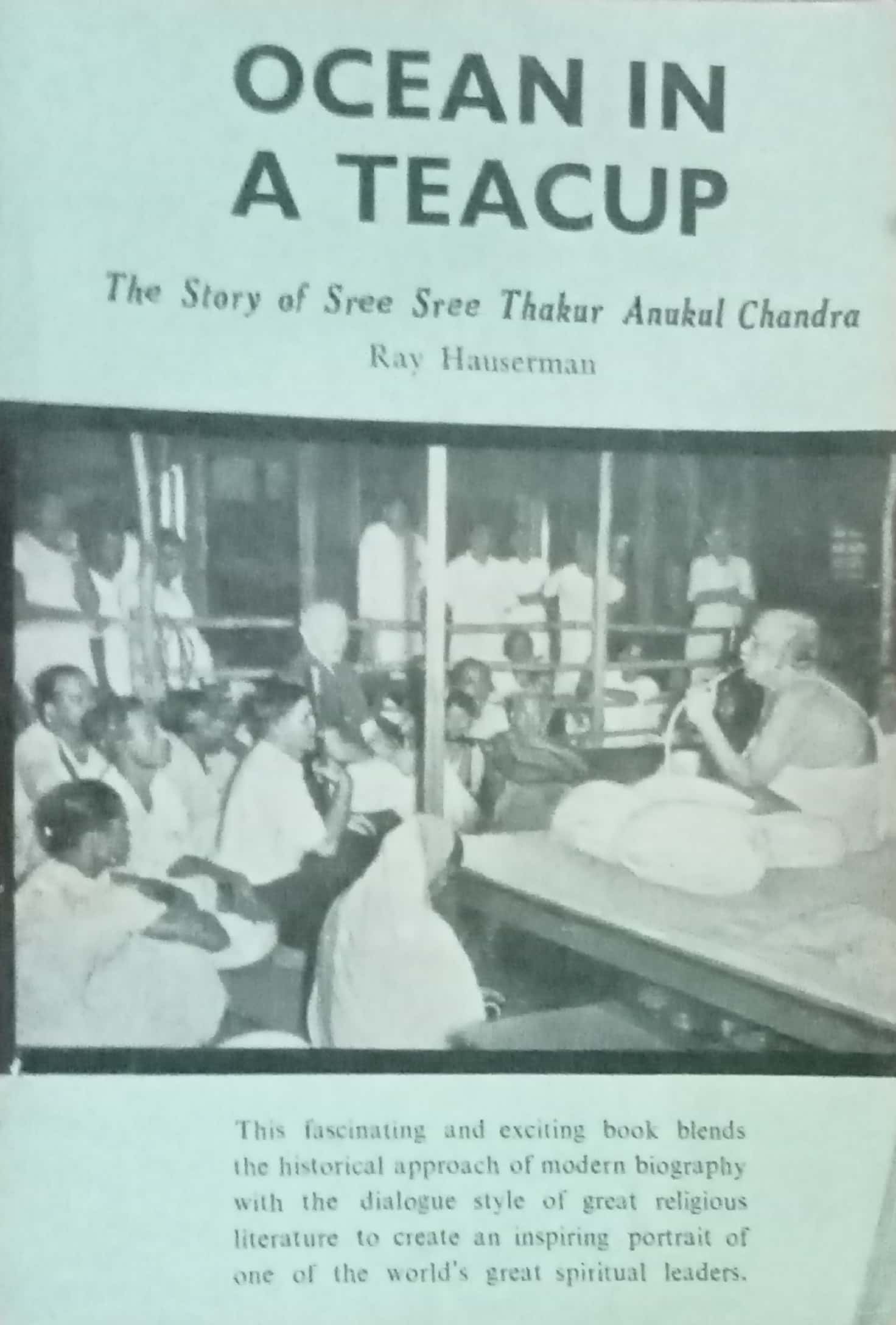 Book cover of 'Ocean in a Teacup' with a black and white photograph of a group of people.