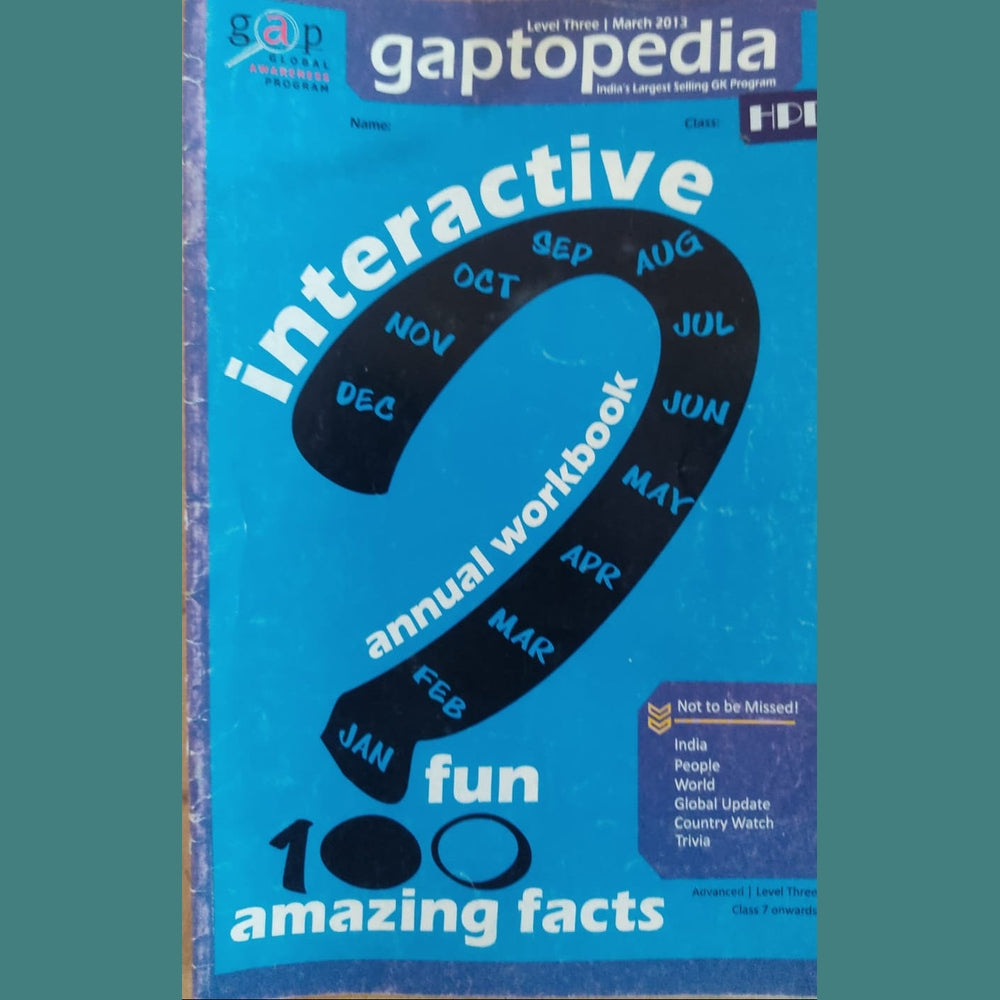 Gaptopedia interactive annual workbook with blue cover and black text on a wooden surface