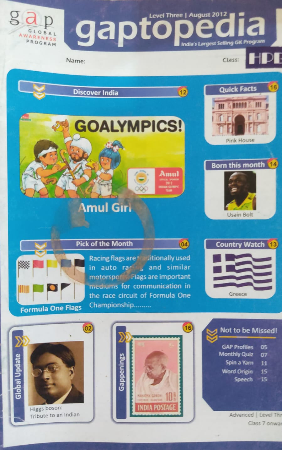Gaptopedia educational book with colorful graphics and text on a wooden surface